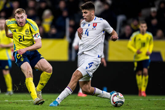 Dejan Kulusevski of Sweden and Adam Obert of Slovakia