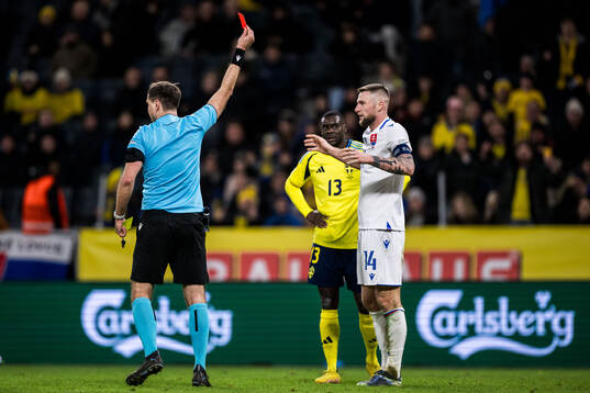 Milan Skriniar of Slovakia receives a red card