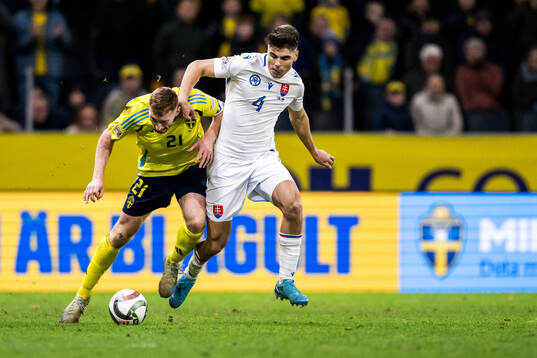 Dejan Kulusevski of Sweden and Adam Obert of Slovakia