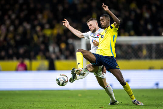 Milan Skriniar of Slovakia and Alexander Isak of Sweden