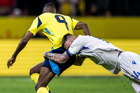 Milan Skriniar of Slovakia and Alexander Isak of Sweden