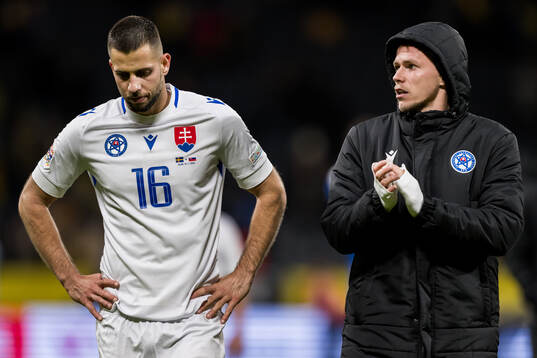 David Hancko of Slovakia looks dejected