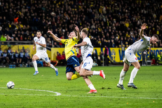 Norbert Gyömber and Milan Skriniar of Slovakia and Viktor
