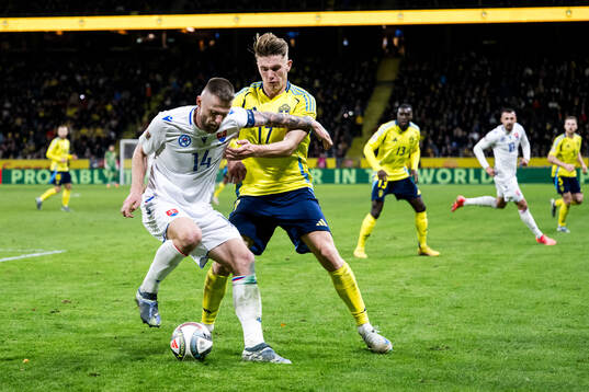 Milan Skriniar of Slovakia and Viktor Gyökeres of Sweden