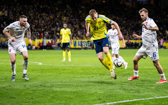 Milan Skriniar and Norbert Gyömber of Slovakia and Dejan