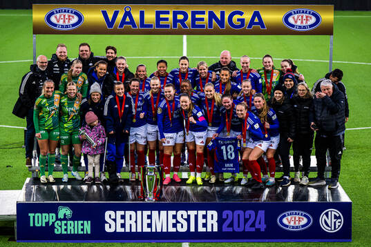 Players of Vålerenga celebrates with the trophy