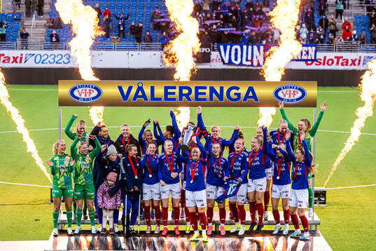 Players of Vålerenga celebrates with the trophy