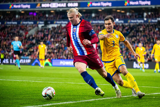 Erling Braut Haaland of Norway and Nuraly Alip of Kazakhstan