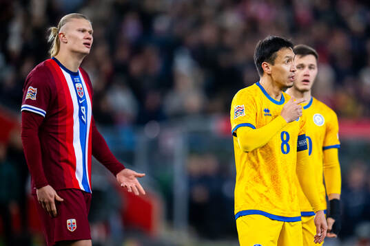 Erling Braut Haaland of Norway and Askhat Tagybergen of