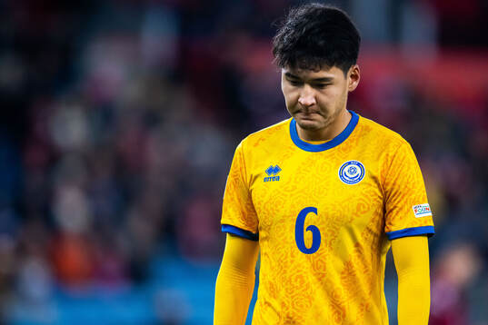 Alibek Kassym of Kazakhstan looks dejected