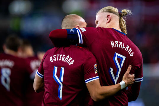 Leo Østigård and Erling Braut Haaland of Norway celebrate