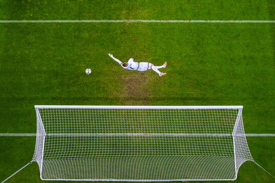 Goalkeeper Stas Pokatilov of Kazakhstan lets in the 5-0 goal