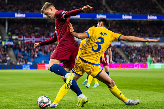 Alexander Sørloth of Norway and Nuraly Alip of Kazakhstan