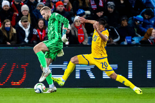 Goalkeeper Egil Selvik of Norway and Aibar Zhaksylykov of