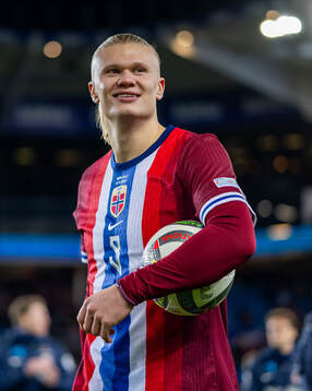 Erling Braut Haaland of Norway with the match ball