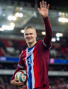 Erling Braut Haaland of Norway with the match ball
