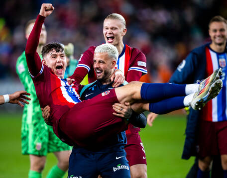 Jørgen Strand Larsen and Aron Dønnum of Norway celebrate