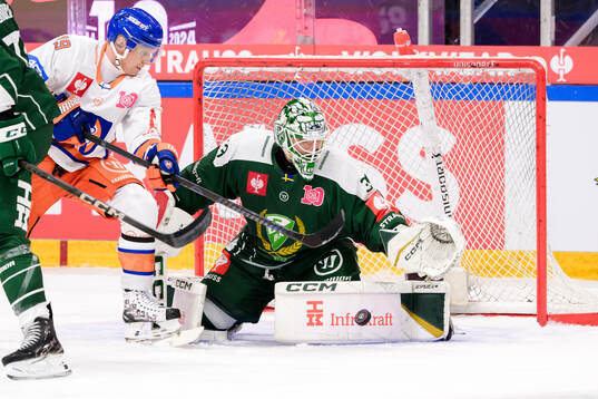 Veli-Matti Savinainen of Tappara Tampere and goaltender