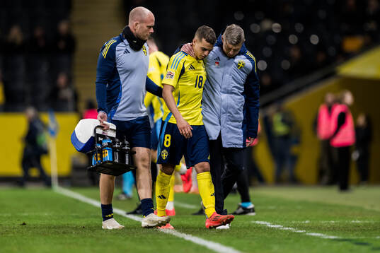 Yasin Ayari of Sweden leaves the pitch injured
