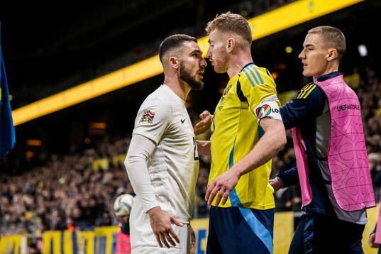 Elvin Jamalov of Azerbaijan and Dejan Kulusevski of Sweden