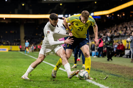 Elvin Jamalov of Azerbaijan and Dejan Kulusevski of Sweden