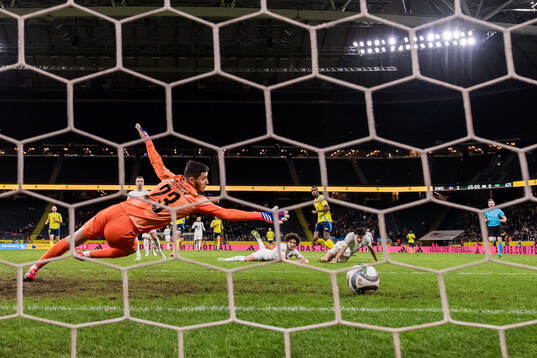 Alexander Isak of Sweden scores a goal that is later