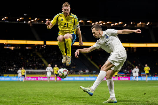 Dejan Kulusevski of Sweden and Joshgun Diniyev of Azerbaijan