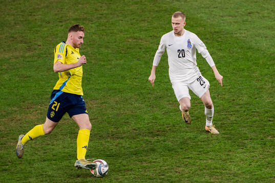 Dejan Kulusevski of Sweden and Rustam Akmedzade of