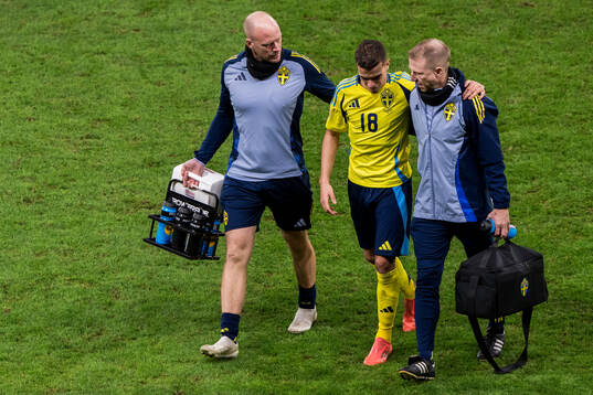 Yasin Ayari of Sweden leaves the pitch injured