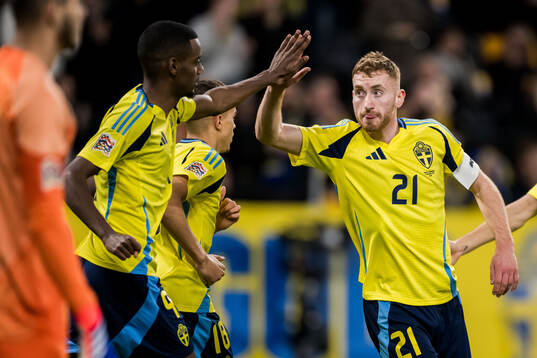 Dejan Kulusevski of Sweden celebrates with Alexander Isak