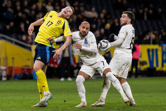 Viktor Gyökeres of Sweden and Renat Dadasov of Azerbaijan
