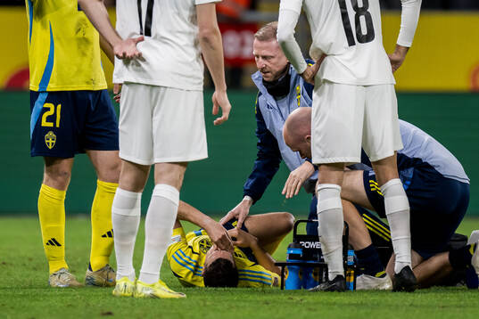 Yasin Ayari of Sweden in pain