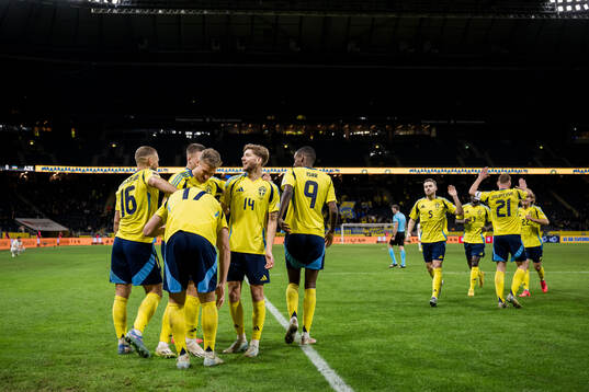 Viktor Gyökeres of Sweden celebrates with team mates