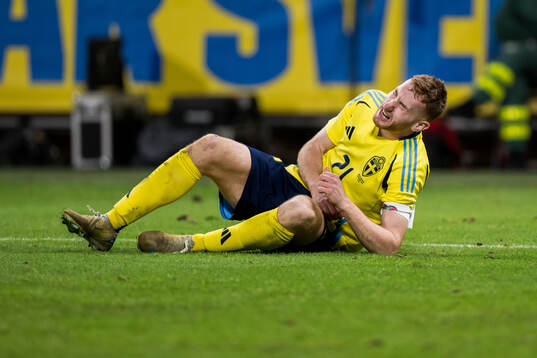 Dejan Kulusevski of Sweden in pain