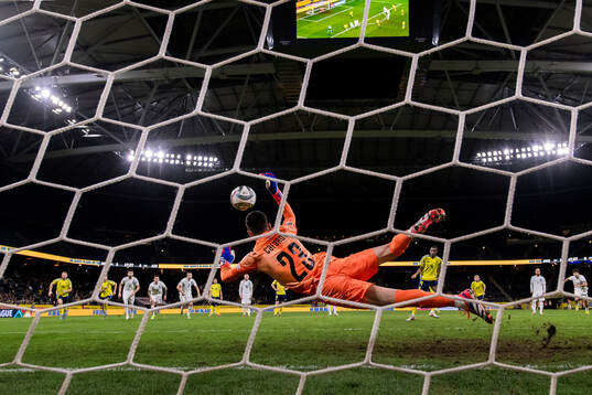 Goalkeeper Elvin Jafarguliyev of Azerbaijan saves a penalty