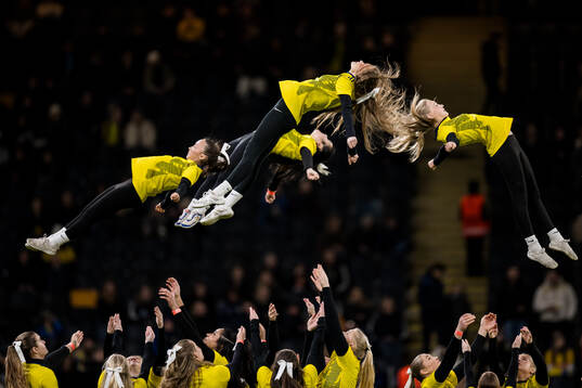 Cheerleaders perform in half-time