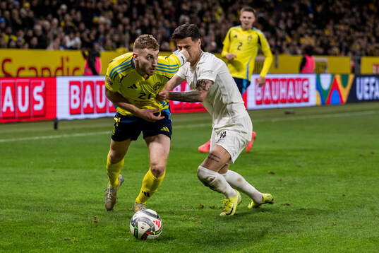 Dejan Kulusevski of Sweden and Mahir Emreli of Azerbaijan