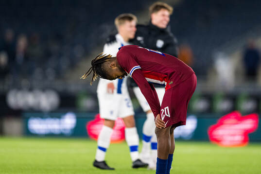 Joel Mugisha of Norway looks dejected