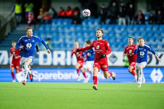 Halldor Stenevik of Molde and Ole Didrik Blomberg of Brann