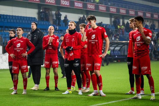 Players of Brann look dejected