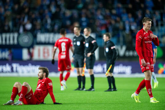 Ole Didrik Blomberg and Emil Kornvig of Brann look dejected