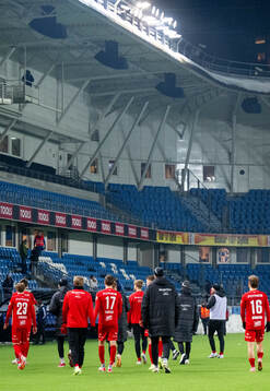 Players of Brann look dejected