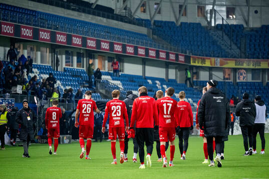Players of Brann look dejected