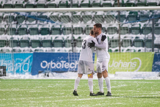 FC Stockholms Jens Stigedahl och David Fällman jublar