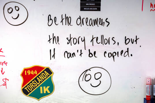 Inspirations citat skrivet på en whiteboard