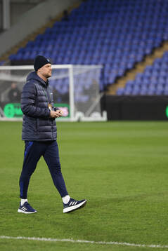 Players of Djurgården inspect the pitch