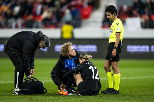 Goalkeeper Sara Cetinja of Serbia and referee Catarina