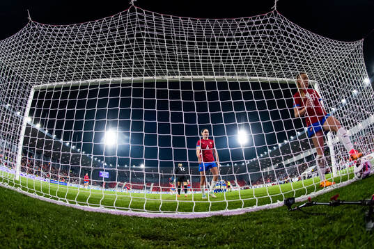 Nevena Damjanovic and Allegra Poljak of Serbia look dejected