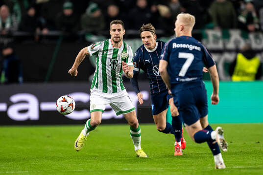 Barnabas Varga of Ferencvaros and Jens Stryger Larsen of