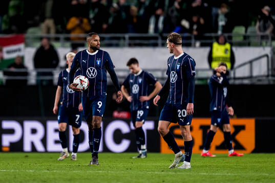 Isaac Kiese Thelin and Niklas Moisander of Malmö FF looks